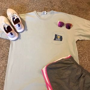 Light blue SALTY DOG CAFE shirt.